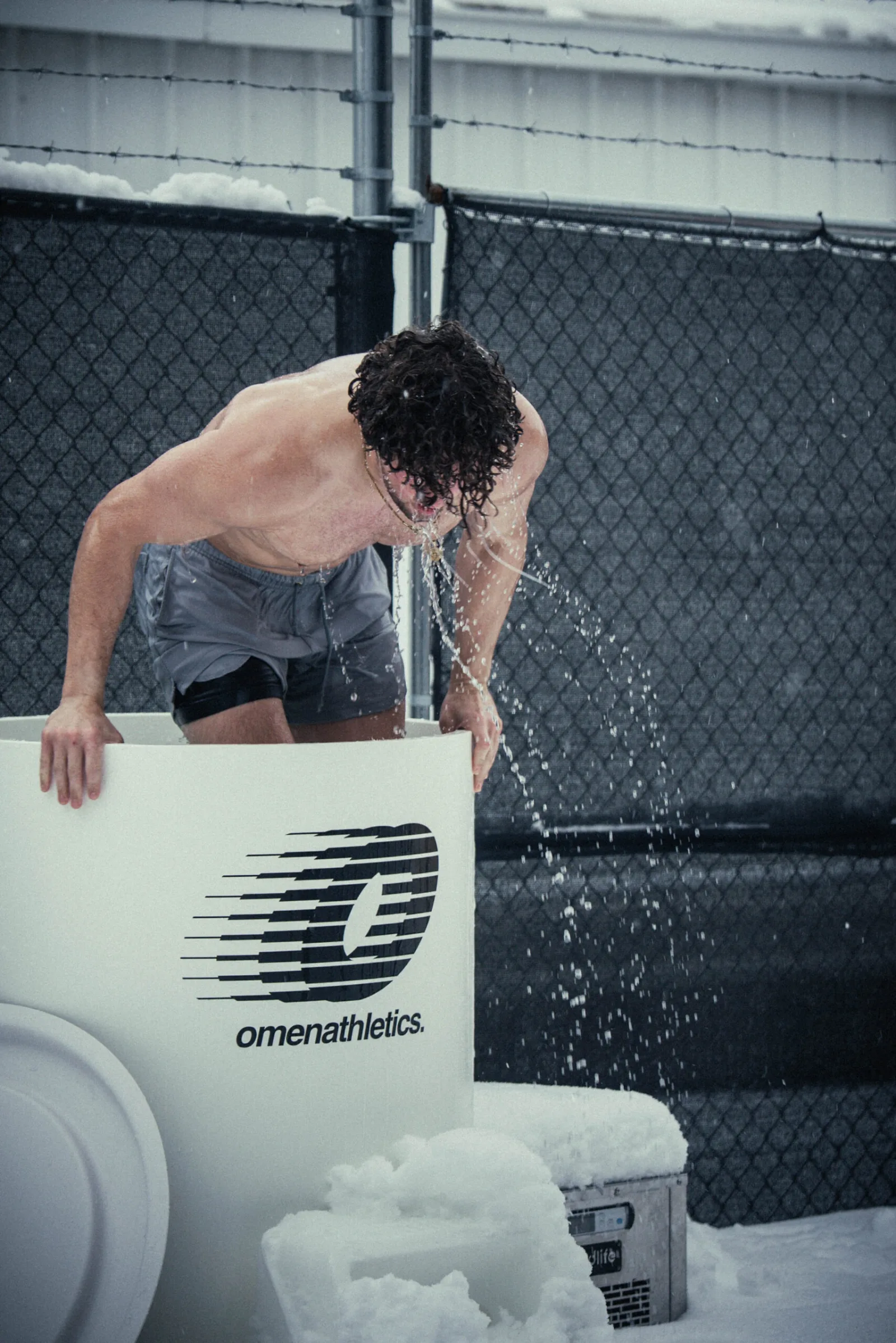 An Omen member completing a winter cold plunge