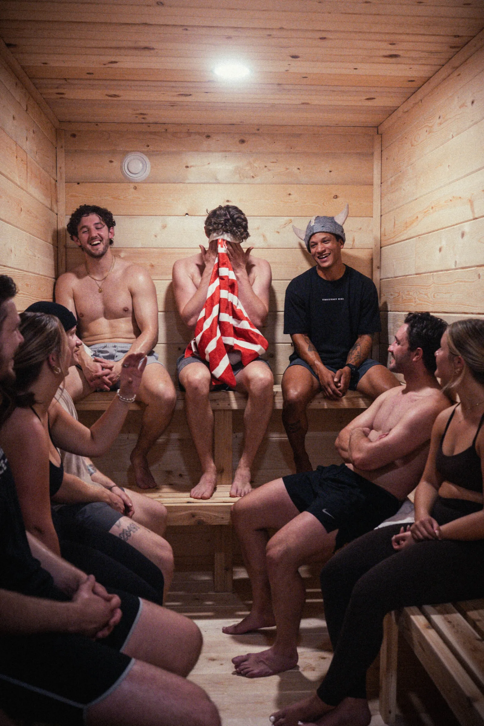 Omen members laughing together in the sauna