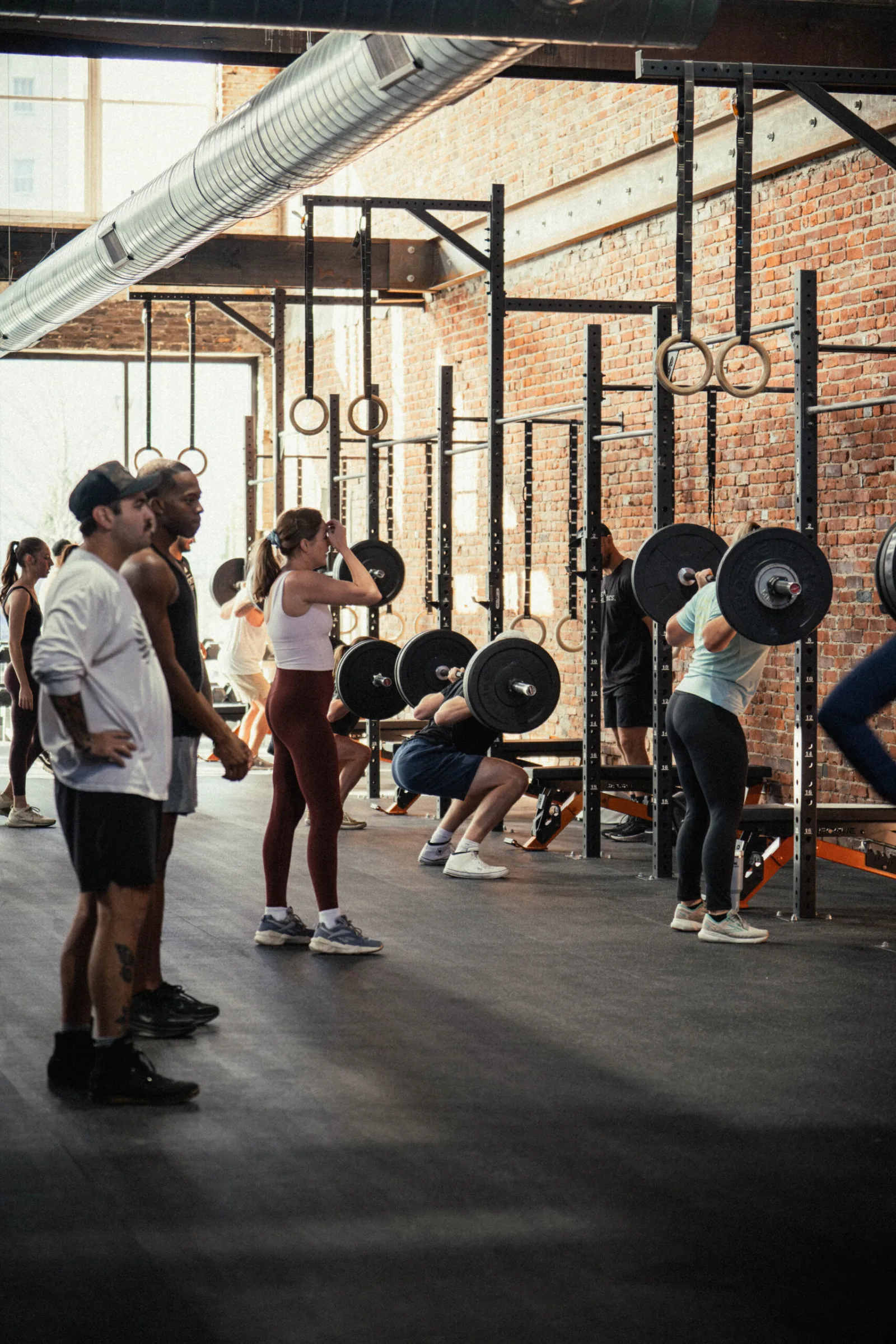 Omen Athletics members training together on the gym floor